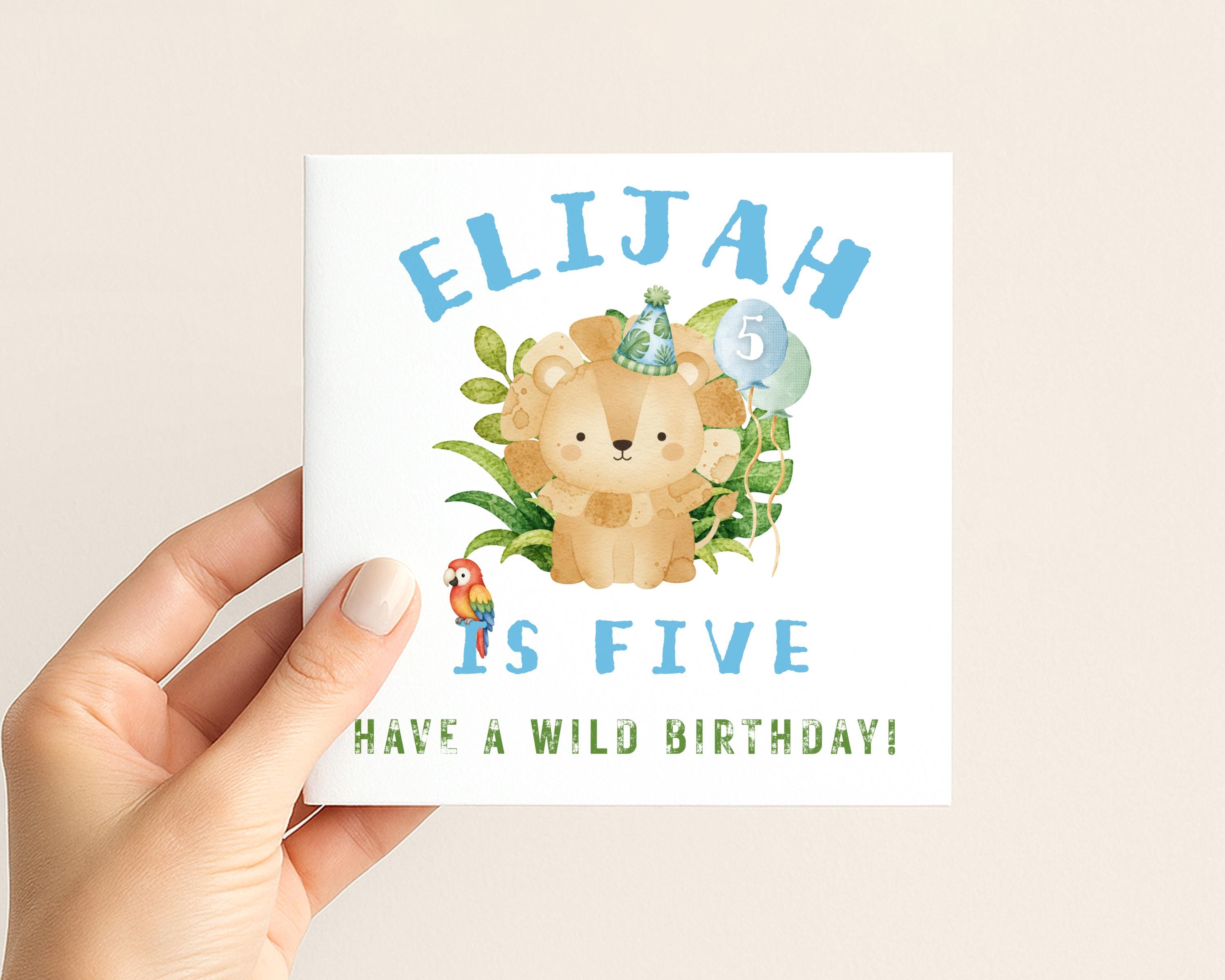 Safari lion birthday card with tropical leaves balloons and parrot